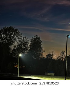 Sunset with dark trees in the fall