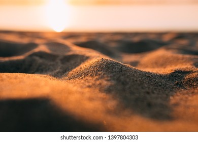 Sunset - dawn on the beach, sand close-up