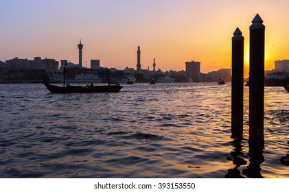 Sunset In Deira Old Town Of Dubai City And Water Taxi,United Arab Emirates