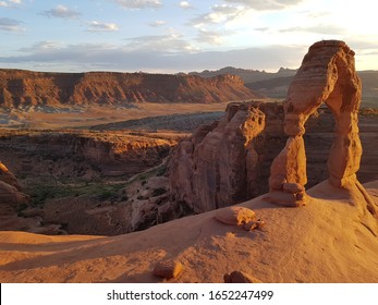 Sunset at delicate arch viewpoint in Arches nationalpark in Utah USA with red sandstone rock arch formation in evening light / sunlight - Shutterstock ID 1652247499