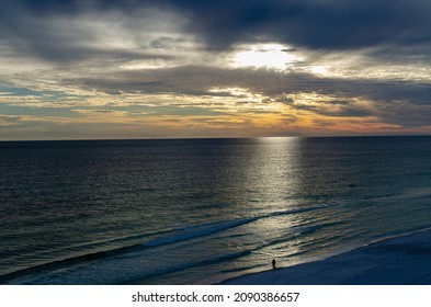 Sunset In Destin FL With Man Looking Out To Sea