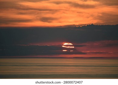 Sunset is the disappearance of the Sun at the end of the Sun path, below the horizon of the Earth due to its rotation.