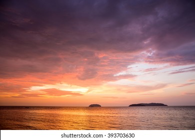 Sunset With Dramatic Clouds On The Tropical Beach While Magic Hour.