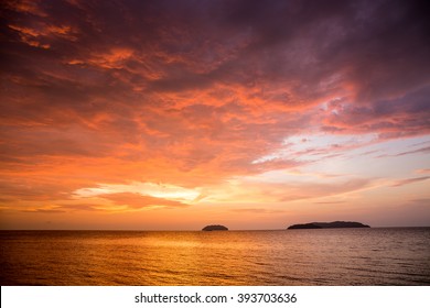 Sunset With Dramatic Clouds On The Tropical Beach While Magic Hour.