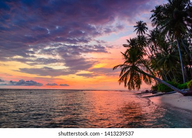 Sunset dramatic sky on sea, tropical desert beach, no people, colorful clouds, travel destination, Indonesia Banyak Islands Sumatra