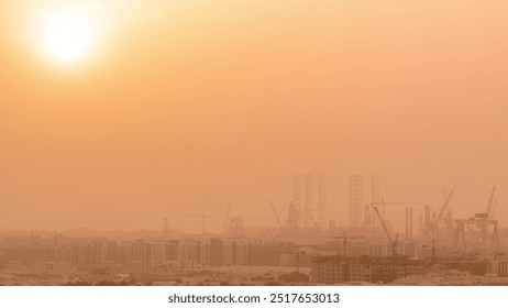 Sunset during sand storm over industry port in Dubai timelapse. Aerial view from above at foggy weather with orange sky - Powered by Shutterstock