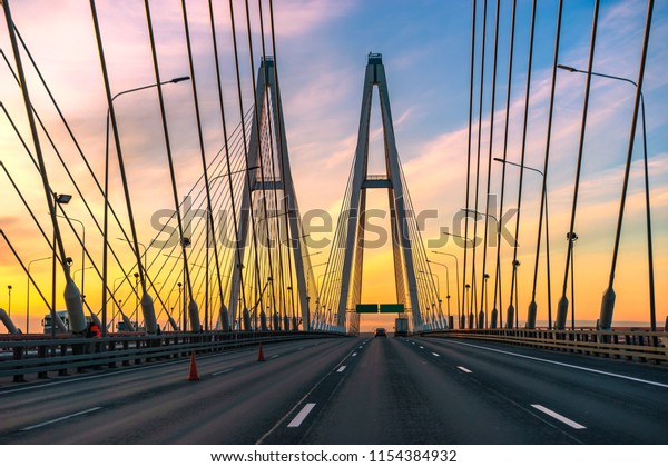 Sunset. Empty bridge. Movement on the bridge.\
The road without cars.\
Motorway.