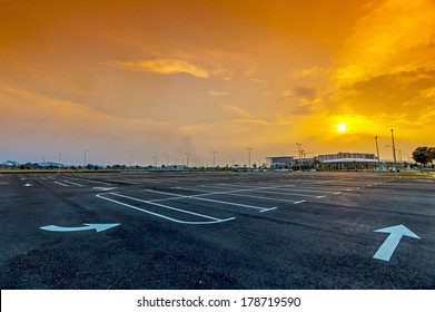 Sunset at empty parking lot