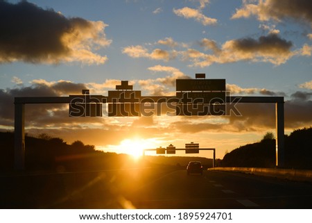 Sunset facing while driving on a road in France