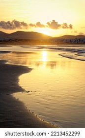 Sunset In Famara Beach. Lanzarote Canary Islands Caleta De Famara, Famara Beach Windsurfing And Surfing Beach In The Evening Light.