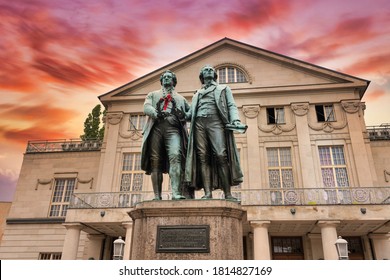 Sunset at the famous German National Theater with Goethe-Schiller Monument in Weimar, Thuringia, Germany