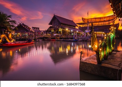 Sunset at famous Pattaya Floating Market which has traditional rowing boats. Villagers sell traditional foods and souvenirs. - Powered by Shutterstock