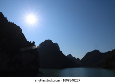 Sunset Flaring. The Sunset Moment On Ha Long Bay. The Sunset Moment On The Mountain.