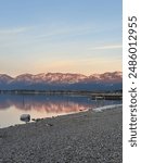 Sunset At Flathead Lake Reflection. Lake reflection. Sunset at the lake. Mission mountains sunset. Glacier lake.