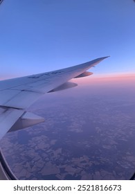 Sunset Flight Window View by Plane Wing 