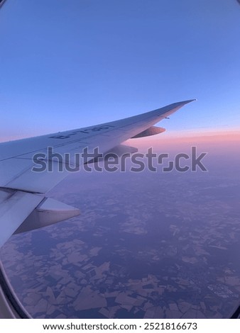 Sunset Flight Window View by Plane Wing 