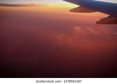 Sunset flight with wing in view