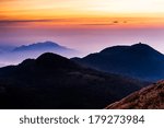 Sunset with flying clouds