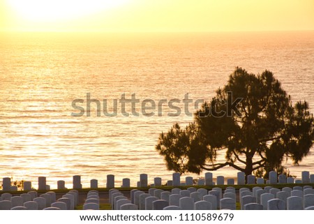 Sunset at Fort Rosecrans National Cemetery with the sun setting over the ocean. Stock photo © 