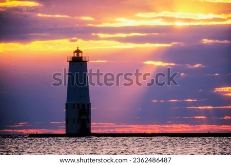 Sunset at Frankfort North Breakwater lighthouse. This 67 foot tower is still an active aid to navigation. Lake Michigan, Frankfort, Michigan, USA, North American