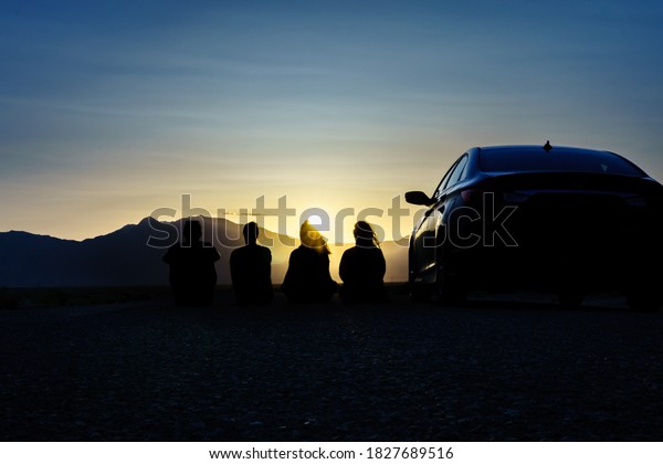 \
Sunset with friends in the desert. Road trip\
Concept