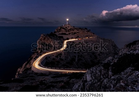 Sunset in front of the beautiful Formentor Lighthouse located in Pollensa. Majorca, Spain