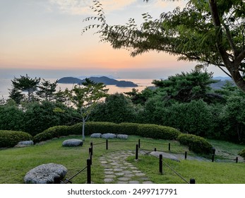 Sunset Garden Pathway with Islands in Background - Powered by Shutterstock