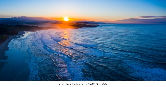 Sunset at Gerra Beach, Oyambre Natural Park, San Vicente de la Barquera Municipality, Cantabrian Sea, Cantabria Autonomous Community, Spain, Europe - Powered by Shutterstock