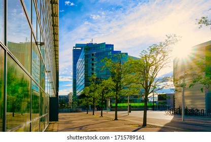 Sunset at Glass Business office building architecture in Modern City in Vienna in Austria. Urban corporate skyscraper exterior and skyline. Blue windows design of Finance commercial center