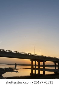 The sunset goes down over bridge 