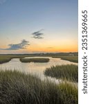 Sunset and golden hour light over The Salt water marsh and the sound behind Pawley