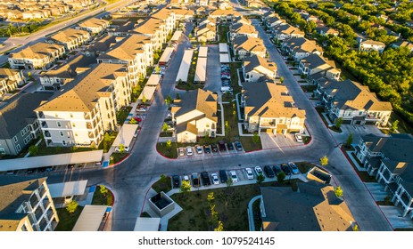 Sunset Golden Hour Suburb Housing Neighborhood Homes In Suburbia - Aerial Drone View - Above Austin , Texas , USA Perfect Cubed Square Houses Living Area In Real Estate Suburban Community At Sunset