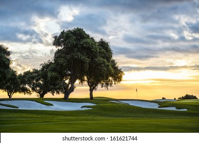 sunset and golf course with flag