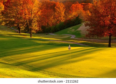 Sunset at the Golf Course - The sun sets on a putting green at the golf course in Autumn. - Powered by Shutterstock