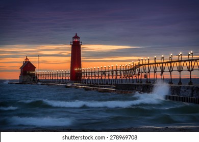 Sunset at the Grand Haven South Pierhead Inner Light with Entrance Light in background in Grand Haven State Park in Grand Haven, Michigan