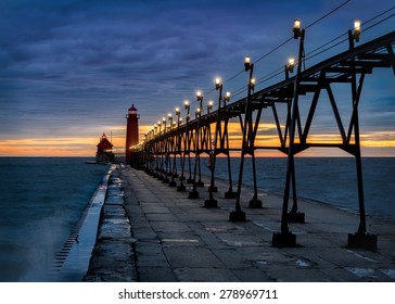 Sunset at the Grand Haven South Pierhead Inner Light with Entrance Light in background in Grand Haven State Park in Grand Haven, Michigan