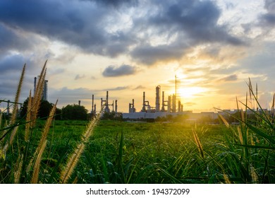 Sunset Green Grass Field And Oil Refinery Backgrounds