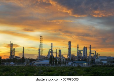 Sunset Green Grass Field And Oil Refinery Backgrounds