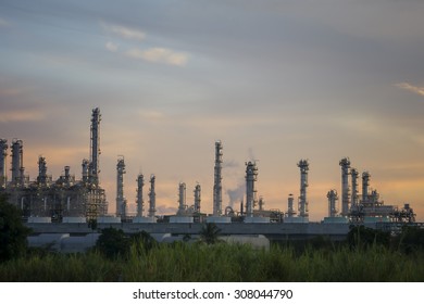 Sunset Green Grass Field And Oil Refinery Backgrounds