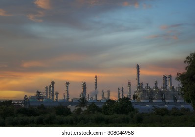 Sunset Green Grass Field And Oil Refinery Backgrounds