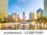 Sunset of Gwanghwamun Plaza with the statue of the Admiral Yi Sun-sin and modern buildings in downtown Seoul,South Korea. 