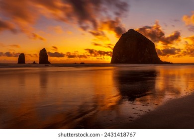 Sunset at Haystack Rock and The Needles at Cannon Beach, Oregon - Powered by Shutterstock