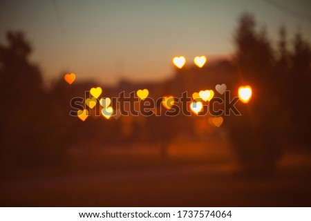 
Sunset hearts bokeh texture background Valentine's day holidays background for letters love yellow orange pink brown warm color