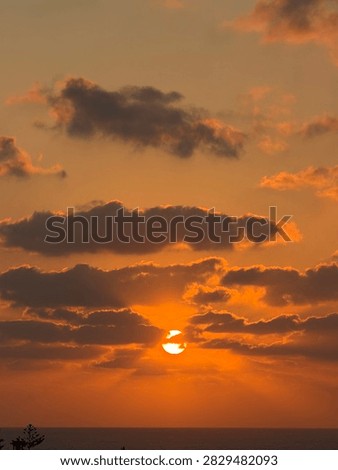 Sunset hiding in the clouds