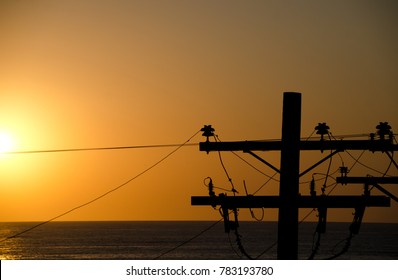 Sunset highlights on  power lines and poles at Mission beach, San Diego