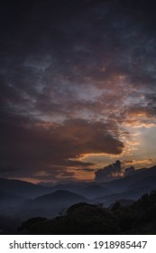 sunset with huge clouds and mountains