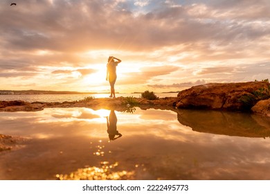 Sunset in Ibiza, a young tourist enjoying in San Antonio Abad. Balearic - Powered by Shutterstock