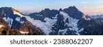 Sunset Illuminates A Panoramic View of Glaciers, Spider Mountain and Mount Formiddable. 
Ptarmigan Traverse, North Cascades National Park, Washington.