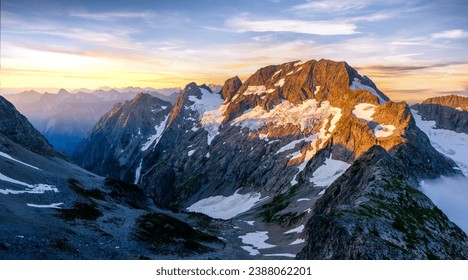 Sunset Illuminates A Panoramic View of Glaciers and Spider Mountain on the  Ptarmigan Traverse. 
					North Cascades National Park, Washington.