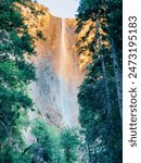 A sunset image of Bridal-veil Fall in Yosemite National Park with the falls glowing from the setting sun